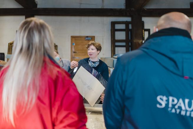 visitors being shown round the collections department