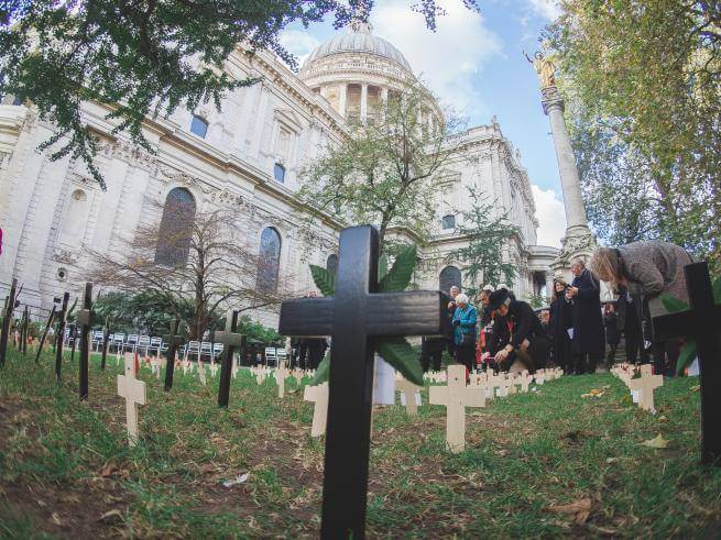 The Garden of Remembrance, with crosses and poppies, is shown in the foreground with the Cathedral behind