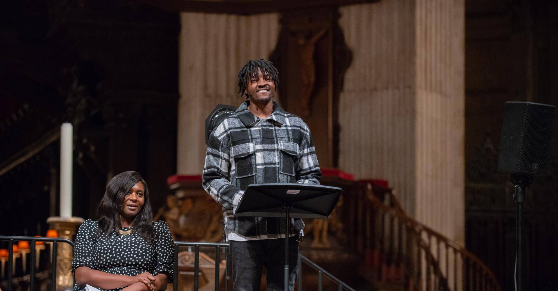 Musician Guvna B speaking at St Paul's Cathedral with Chine McDonald alongside