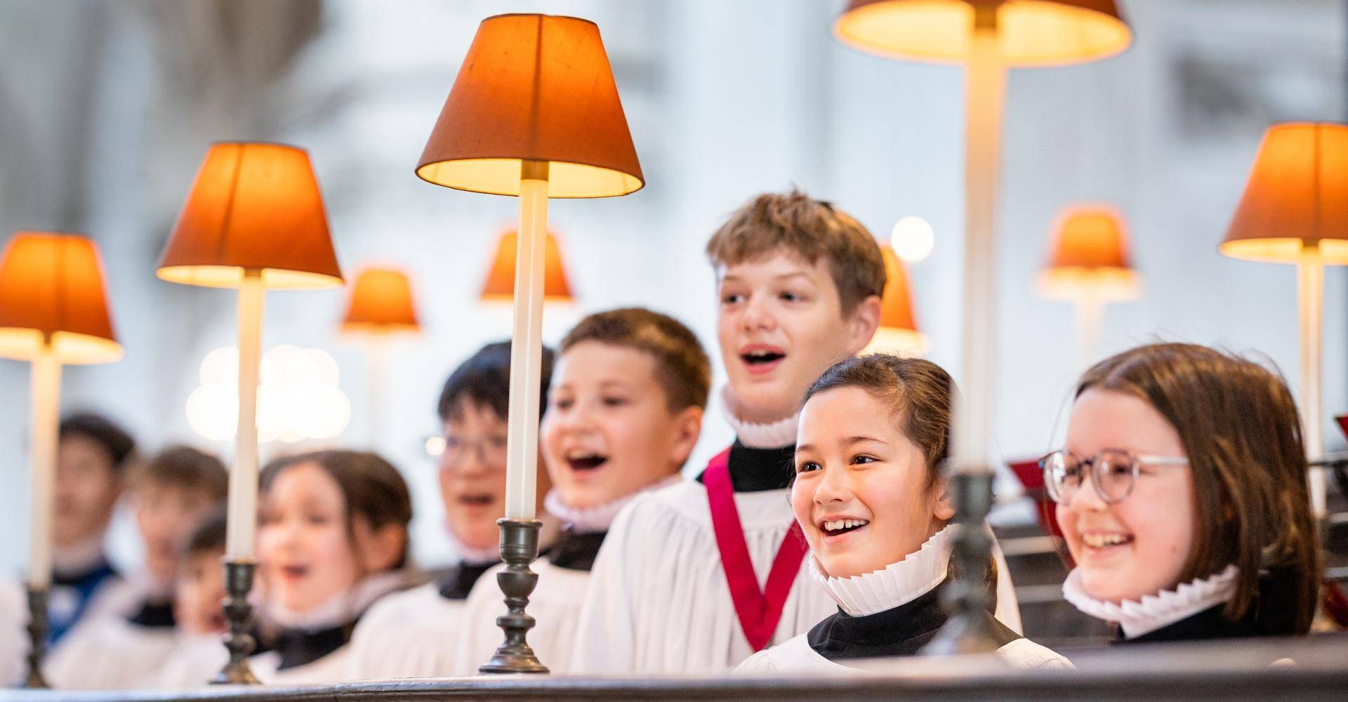 Boy and girl choristers singing in the quire