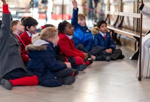 children school hands up engaged