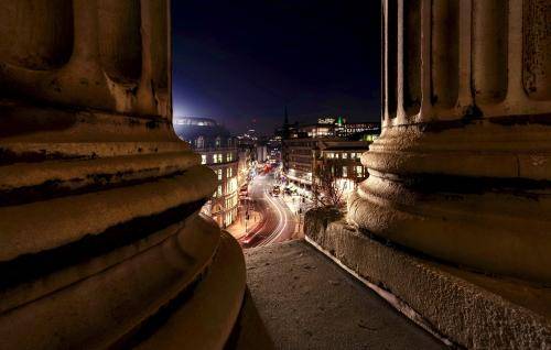 night steps of cathedral cars passing