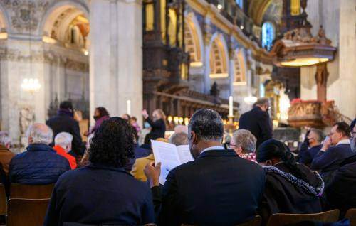 couple reading service schedule during consecration service