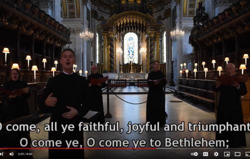 Members of the Vicars Choral singing in the Quire at St Paul's Cathedral