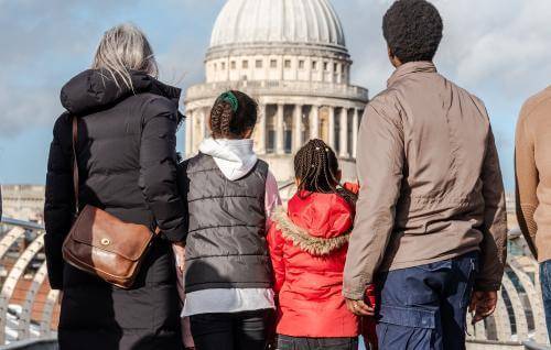 family looking at the dome from the millenium bridge