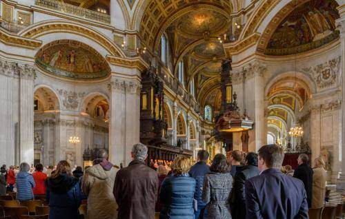 large congregation standing in the cathedral