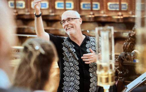 Patrick Craig conducting a choir