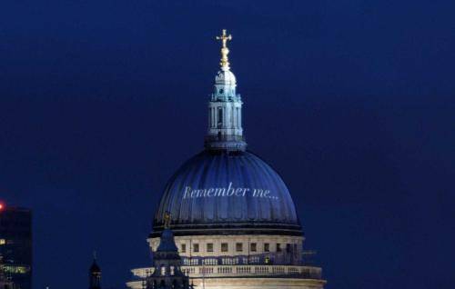 The words Remember Me projected on the white dome of St Paul's at night