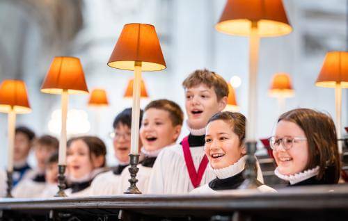 Boy and girl choristers singing in the quire